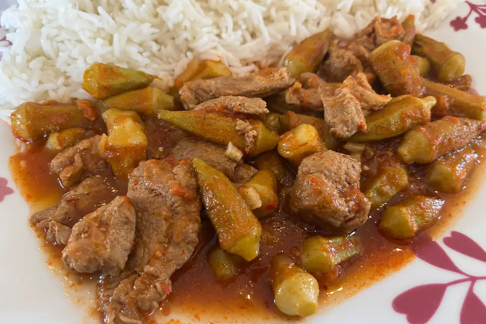 Okra with meat served next to rice