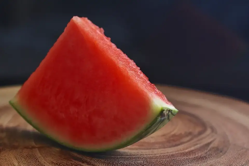 A slice of watermelon on wood