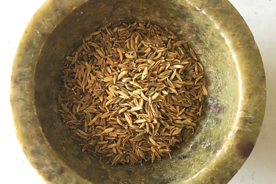 Whole cumin seeds in a bowl