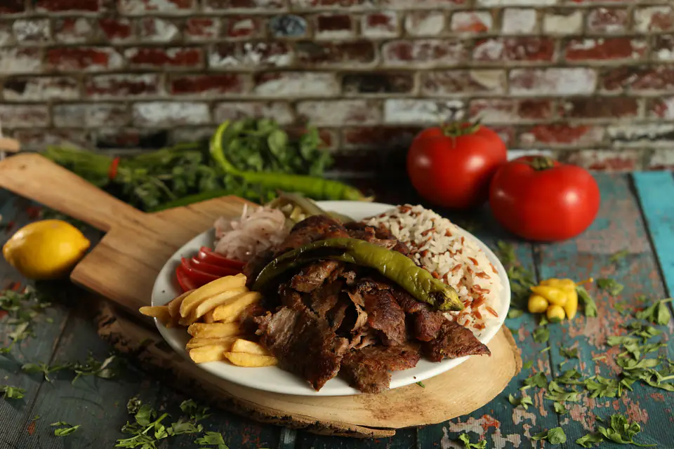 Beef döner with rice and French fries on a plate