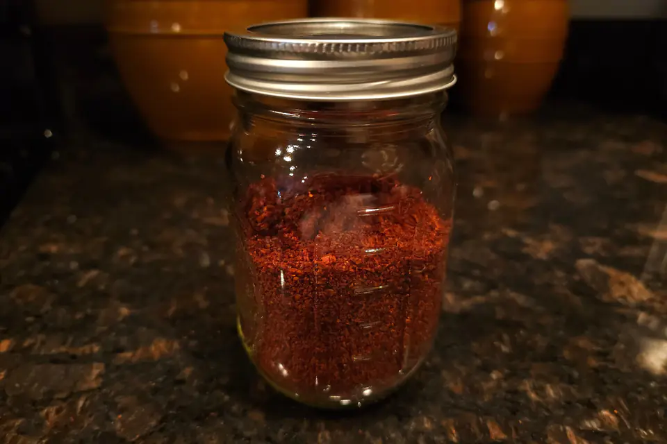 Red pepper flakes in a glass jar