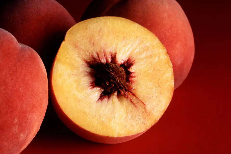 Ripe peaches cut in half