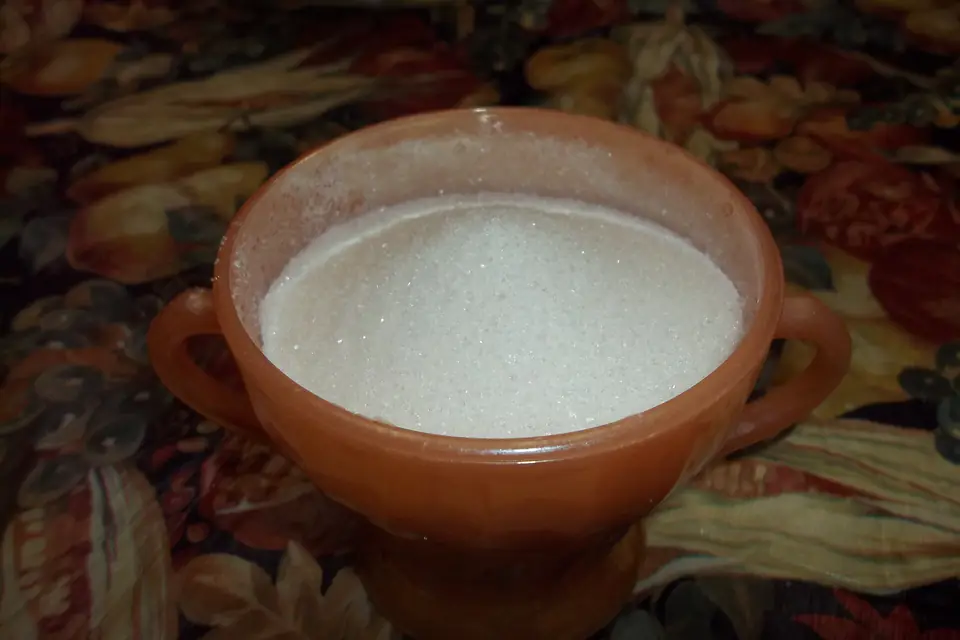 Granulated sugar in a clay bowl