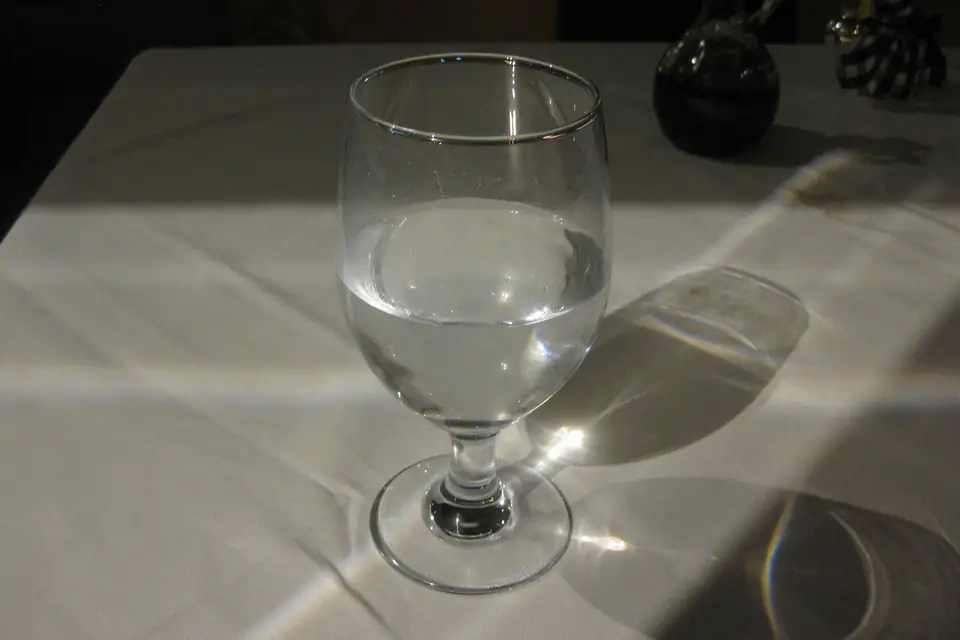 A glass of water on a table