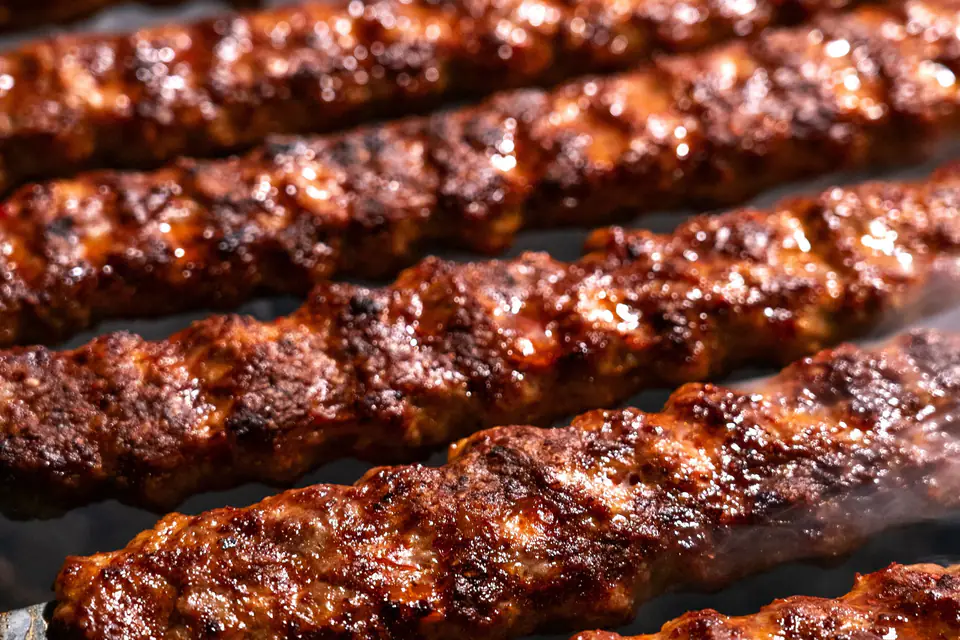 Ground meat skewers on the grill