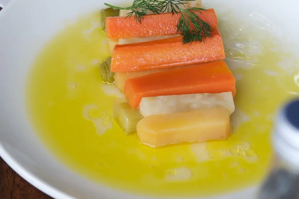 Celeriac and carrot slices in olive oil with dill